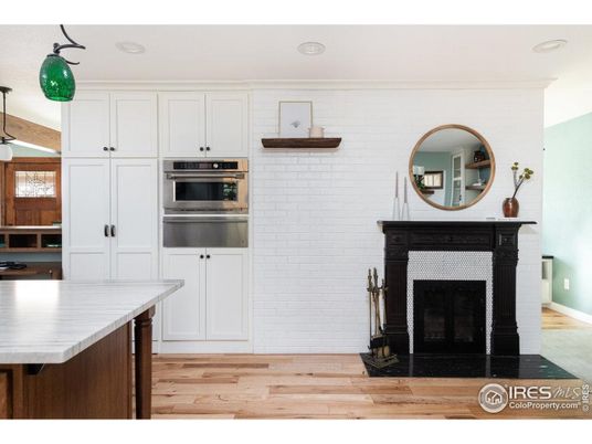 Fireplace, Interior, Kitchen, Recessed Lighting, Stainless Steel Appliances, Wood Texture Flooring