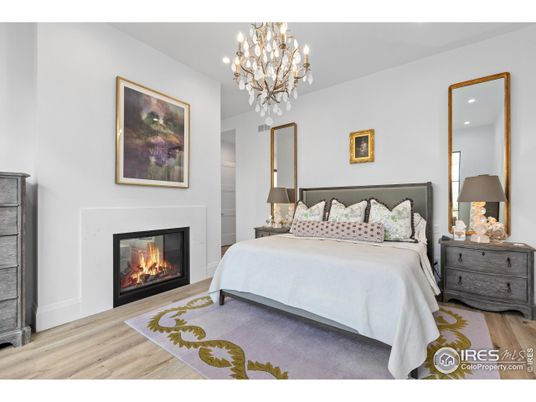 Bedroom, Chandelier, Fireplace, Interior, Recessed Lighting, Wood Texture Flooring
