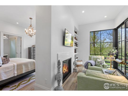 Bedroom, Chandelier, Fireplace, Interior, Recessed Lighting, Wood Texture Flooring