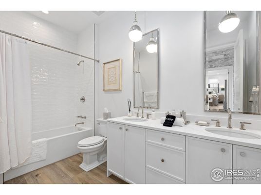 Bathroom, Dual Sink Vanities, Interior, Pendant Lights, Recessed Lighting, Wood Texture Flooring