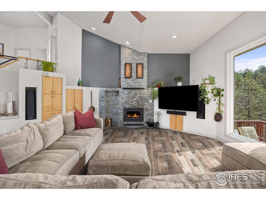 Fireplace, Interior, Living room, Recessed Lighting, Stone Walls, Wood Texture Flooring