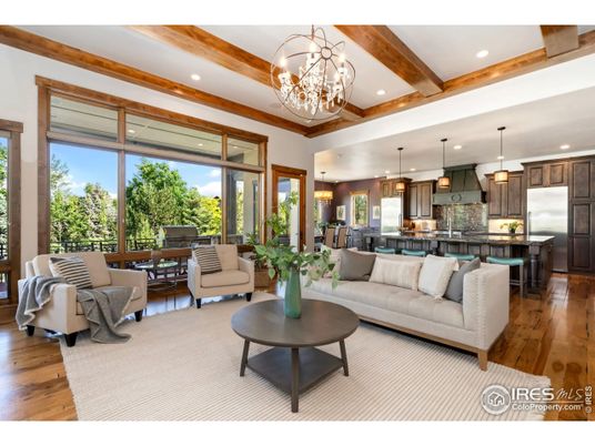Chandelier, Dining room, Interior, Kitchen, Living room, Pendant Lights, Recessed Lighting, Stainless Steel Appliances, Wooden Beams, Wood Texture Flooring