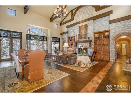 Chandelier, Dining room, Fireplace, Interior, Living room, Stone Walls, Wooden Beams, Wood Texture Flooring