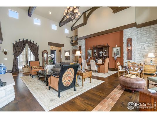 Chandelier, Dining room, Interior, Living room, Recessed Lighting, Stone Walls, Wooden Beams, Wood Texture Flooring