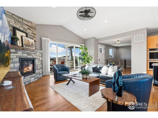 Fireplace, Interior, Living room, Recessed Lighting, Stone Walls, Wood Texture Flooring