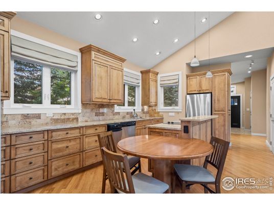 Dining room, Interior, Kitchen, Pendant Lights, Recessed Lighting, Stainless Steel Appliances, Wood Texture Flooring