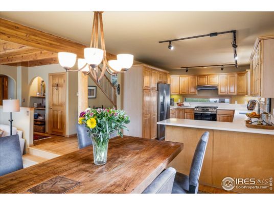 Chandelier, Dining room, Interior, Kitchen, Stainless Steel Appliances, Wooden Beams, Wood Texture Flooring