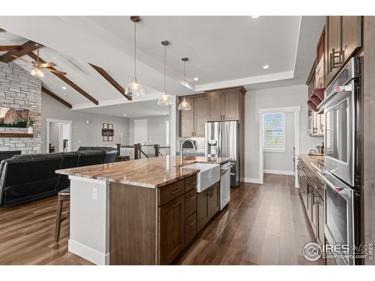 Interior, Kitchen, Living room, Pendant Lights, Recessed Lighting, Stainless Steel Appliances, Stone Walls, Wood Texture Flooring