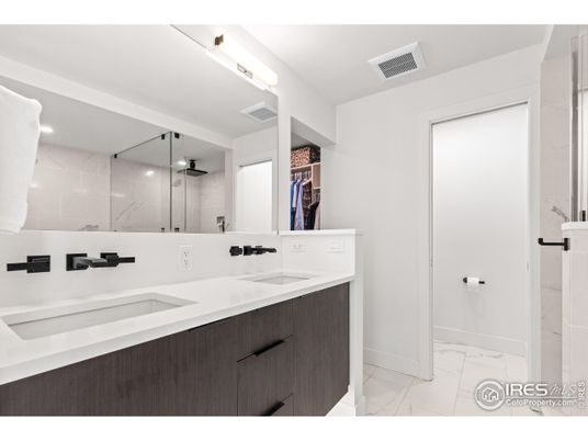 Bathroom, Dual Sink Vanities, Glass Shower, Interior, Marble, Marble Walls, Recessed Lighting