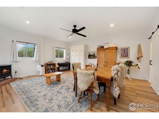 Dining room, Fireplace, Interior, Piano, Recessed Lighting, Wood Texture Flooring