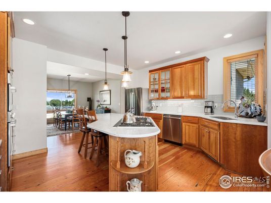 Dining room, Interior, Kitchen, Pendant Lights, Recessed Lighting, Stainless Steel Appliances, Wood Texture Flooring