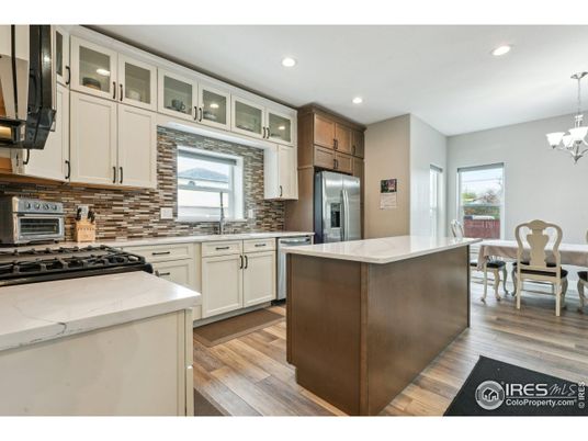 Chandelier, Dining room, Interior, Kitchen, Recessed Lighting, Stainless Steel Appliances, Wood Texture Flooring