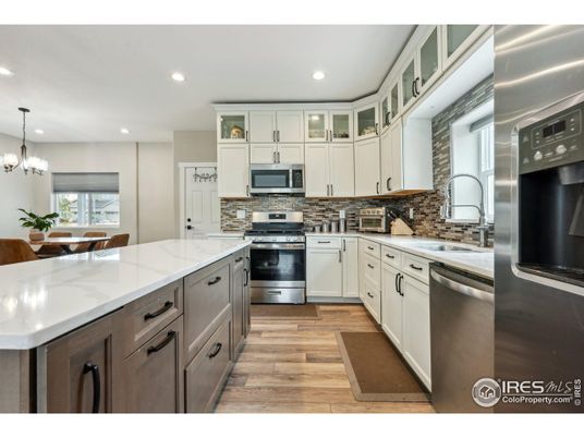 Chandelier, Interior, Kitchen, Recessed Lighting, Stainless Steel Appliances, Wood Texture Flooring
