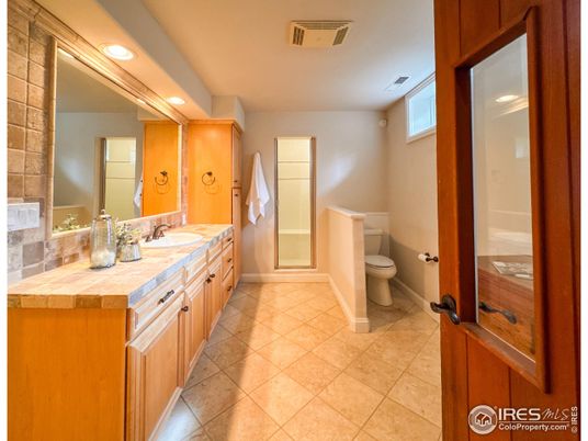 Bathroom, Dual Sink Vanities, Interior, Recessed Lighting, Tile Countertops