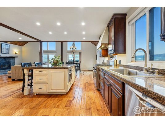 Dining room, Fireplace, Interior, Kitchen, Living room, Recessed Lighting, Stainless Steel Appliances, Wood Texture Flooring