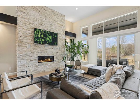 Fireplace, Interior, Living room, Recessed Lighting, Stone Walls, Wood Texture Flooring