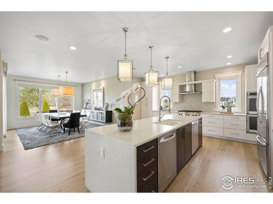 Dining room, Interior, Kitchen, Pendant Lights, Recessed Lighting, Stainless Steel Appliances, Wood Texture Flooring