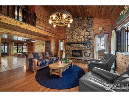 Chandelier, Fireplace, Interior, Living room, Pendant Lights, Stone Walls, Wooden Ceilings, Wood Texture Flooring, Wooden Walls