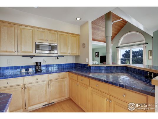 Interior, Kitchen, Recessed Lighting, Tile Countertops, Wood Texture Flooring