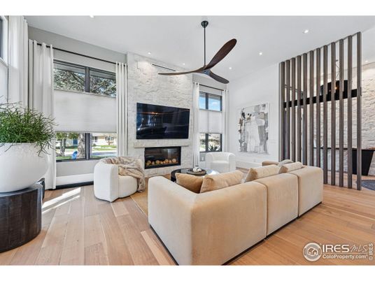 Fireplace, Interior, Living room, Recessed Lighting, Stone Walls, Wood Texture Flooring