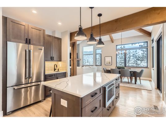Dining room, Interior, Kitchen, Pendant Lights, Recessed Lighting, Stainless Steel Appliances, Wooden Beams, Wood Texture Flooring