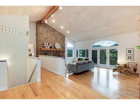 Fireplace, Interior, Living room, Recessed Lighting, Stone Walls, Wood Texture Flooring