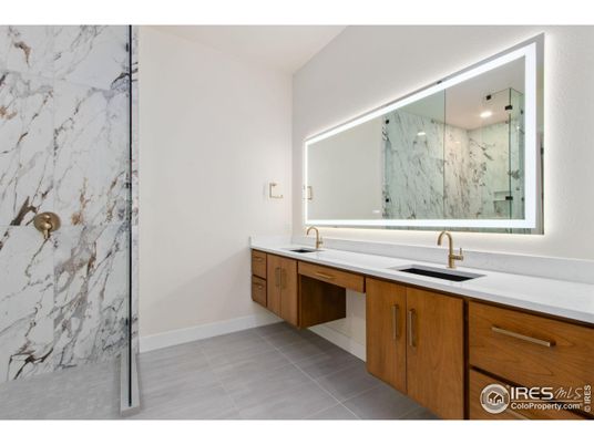 Bathroom, Dual Sink Vanities, Glass Shower, Interior, Marble Walls, Recessed Lighting