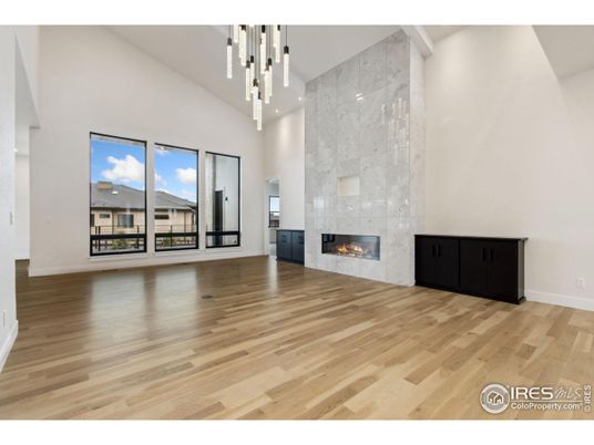 Empty room, Fireplace, Interior, Marble Walls, Pendant Lights, Wood Texture Flooring