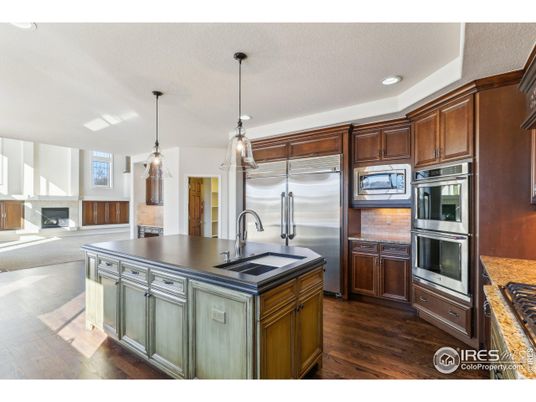 Fireplace, Interior, Kitchen, Pendant Lights, Recessed Lighting, Stainless Steel Appliances, Wood Texture Flooring