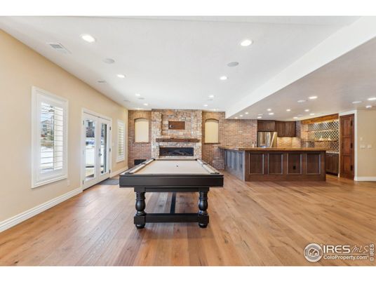 Billiard Table, Fireplace, Game Room, Interior, Recessed Lighting, Stone Walls, Wood Texture Flooring