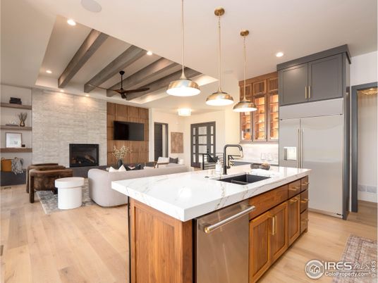 Fireplace, Interior, Kitchen, Living room, Pendant Lights, Recessed Lighting, Stainless Steel Appliances, Stone Walls, Wooden Beams, Wood Texture Flooring