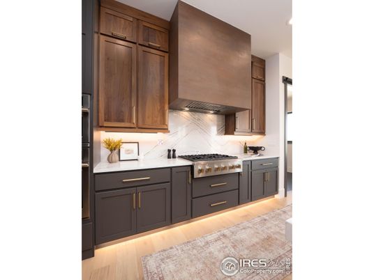 Interior, Kitchen, Marble Walls, Recessed Lighting, Stainless Steel Appliances, Wood Texture Flooring