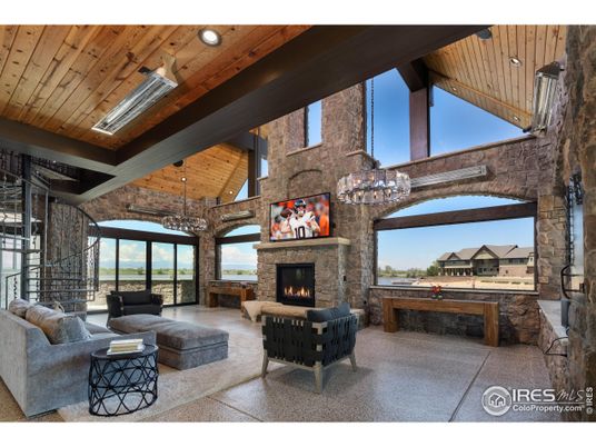 Chandelier, Fireplace, Interior, Living room, Recessed Lighting, Stone Walls, Wooden Beams, Wooden Ceilings