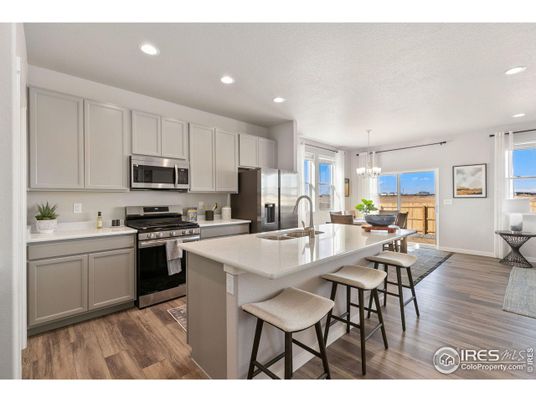 Chandelier, Dining room, Interior, Kitchen, Pendant Lights, Recessed Lighting, Stainless Steel Appliances, Wood Texture Flooring