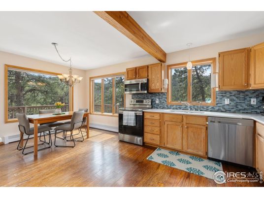 Chandelier, Dining room, Interior, Kitchen, Stainless Steel Appliances, Wooden Beams, Wood Texture Flooring
