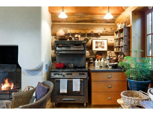 Fireplace, Interior, Kitchen, Pendant Lights, Stainless Steel Appliances, Wooden Ceilings, Wooden Walls