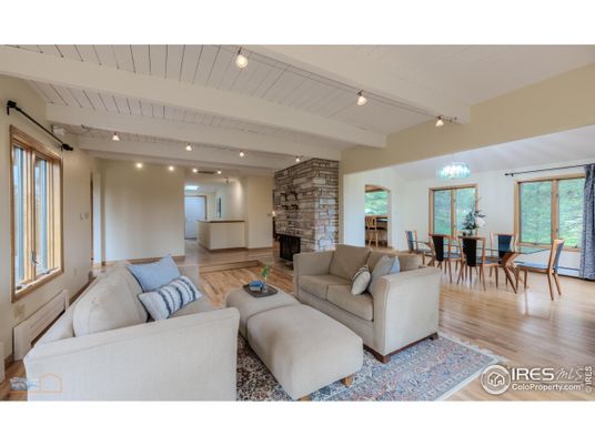 Chandelier, Dining room, Fireplace, Interior, Living room, Recessed Lighting, Stone Walls, Wood Texture Flooring