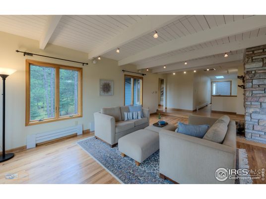 Fireplace, Interior, Living room, Recessed Lighting, Stone Walls, Wood Texture Flooring