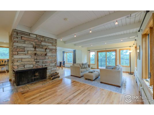 Fireplace, Interior, Living room, Recessed Lighting, Stone Walls, Wood Texture Flooring