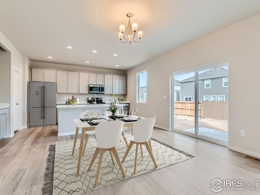 Chandelier, Dining room, Interior, Kitchen, Recessed Lighting, Stainless Steel Appliances, Wood Texture Flooring
