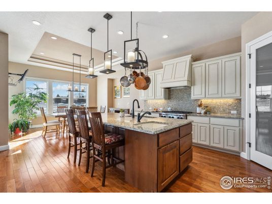 Dining room, Interior, Kitchen, Pendant Lights, Recessed Lighting, Stainless Steel Appliances, Wood Texture Flooring