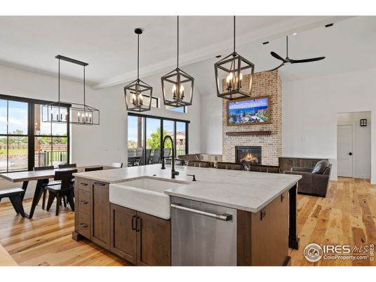 Dining room, Fireplace, Interior, Kitchen, Living room, Pendant Lights, Recessed Lighting, Stainless Steel Appliances, Stone Walls, Wood Texture Flooring
