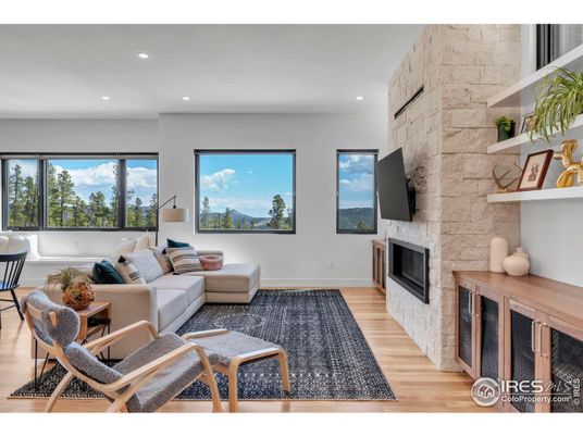 Fireplace, Interior, Living room, Recessed Lighting, Stone Walls, Wood Texture Flooring