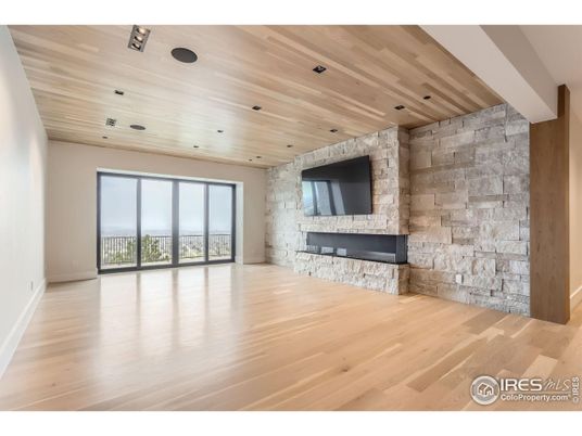 Empty room, Fireplace, Interior, Recessed Lighting, Stone Walls, Wooden Ceilings, Wood Texture Flooring