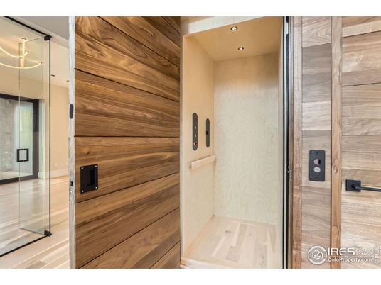 Elevator, Interior, Recessed Lighting, Wood Texture Flooring, Wooden Walls