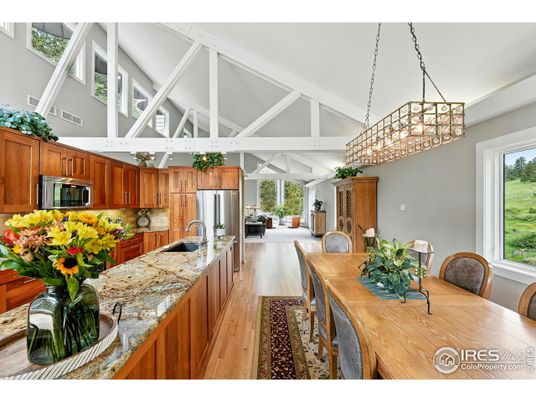 Chandelier, Dining room, Interior, Kitchen, Living room, Pendant Lights, Stainless Steel Appliances, Wood Texture Flooring