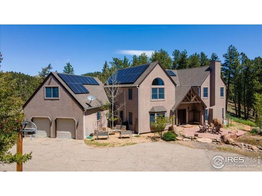 Attached, Exterior, Facade, Solar Panels, Tudor Revival