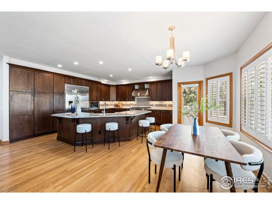 Chandelier, Dining room, Interior, Kitchen, Recessed Lighting, Stainless Steel Appliances, Wood Texture Flooring