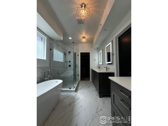 Bathroom, Dual Sink Vanities, Free Standing Baths, Glass Shower, Interior, Marble, Marble Walls, Recessed Lighting
