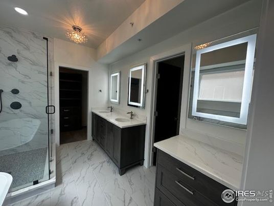 Bathroom, Dual Sink Vanities, Glass Shower, Interior, Marble, Marble Walls, Recessed Lighting